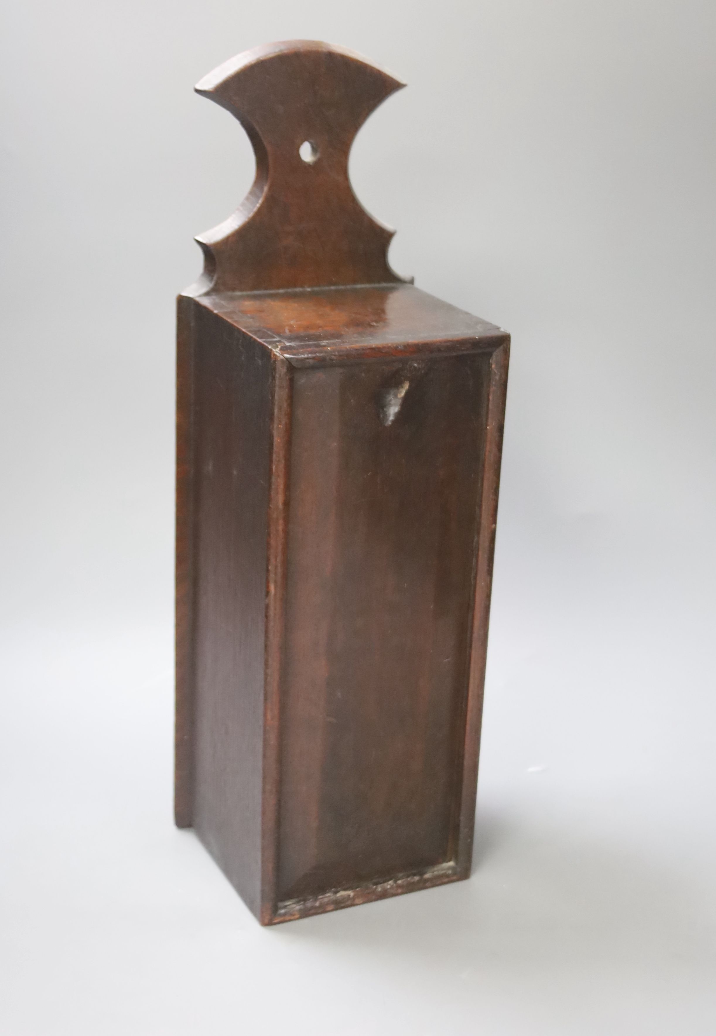 A 19th century oak candle box, height 45cm